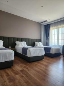 Postel nebo postele na pokoji v ubytování Imperador Palace Hotel Restorant