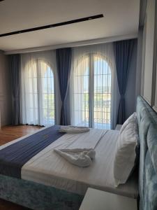 Postel nebo postele na pokoji v ubytování Imperador Palace Hotel Restorant