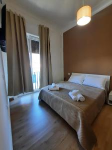 Postel nebo postele na pokoji v ubytování LE CAMERE DI VIA MECCIO