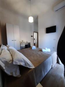 Postel nebo postele na pokoji v ubytování LE CAMERE DI VIA MECCIO