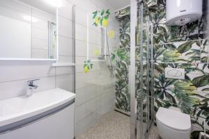 a bathroom with a toilet and a sink at Villa Lucia 2 in Dramalj +32 photos