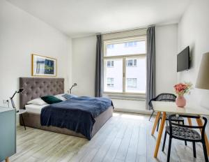 Posteľ alebo postele v izbe v ubytovaní Porta Downtown Apartments by Irundo