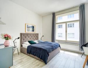 Posteľ alebo postele v izbe v ubytovaní Porta Downtown Apartments by Irundo