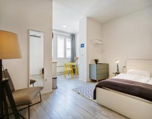 Posteľ alebo postele v izbe v ubytovaní Porta Downtown Apartments by Irundo