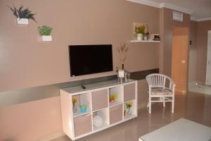Телевізор і / або розважальний центр в Residencial La Quinta Park Suites