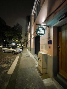 a sign on the side of a building at night at MyTrip Porto in Matosinhos