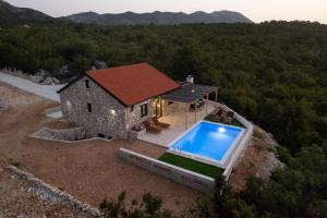 an overhead view of a house with a swimming pool at Villa Ivanka in Neum