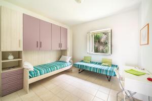 Voodi või voodid majutusasutuse Affaccio sul Lago by BarbarHouse toas
