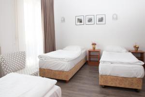 Postel nebo postele na pokoji v ubytování Sabotin, Hotel & Restaurant