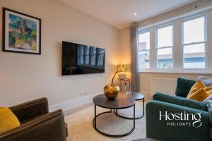 a living room with a couch and a table at The Oars Apartment - Marlow - Parking Included in Marlow