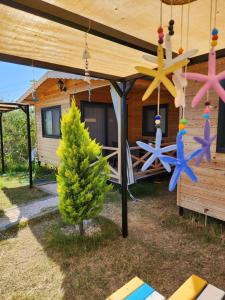 a cabin with a porch with star decorations on it at Sea garden apart in Demre