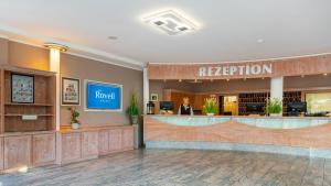 a reception area of a hotel with a reception desk at Ostseehotel Villen im Park - ein Rovell Hotel in Bansin