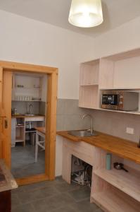 a kitchen with a sink and a counter top at Вершище in Urych +16 photos