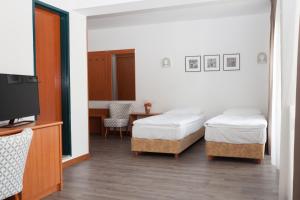 Postel nebo postele na pokoji v ubytování Sabotin, Hotel & Restaurant