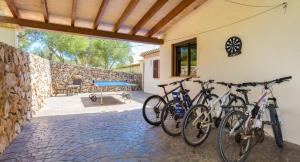 a group of bikes parked on the side of a house at Puig de Ses Toltes in Sant Llorenç des Cardassar