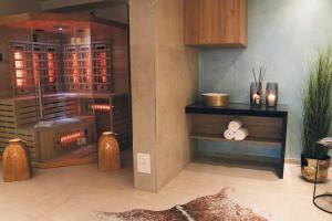 a room with a wine cellar with wooden cabinets at salinenparc Design Budget Hotel in Erwitte