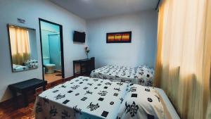 Postel nebo postele na pokoji v ubytování Hotel Beijing Cartagena