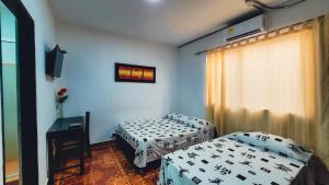 Postel nebo postele na pokoji v ubytování Hotel Beijing Cartagena