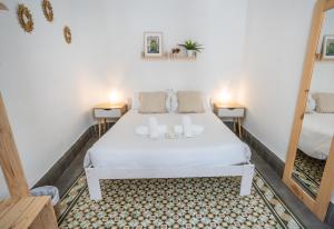 Postel nebo postele na pokoji v ubytování Casa de la Alegría