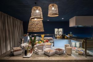 a table with food on it in a kitchen at Falkensteiner Hotel Park Punat in Punat