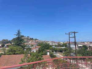 a view of a city from a balcony at Katerina's Apartment in Vonitsa