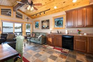 a kitchen and living room with a ceiling fan at 1247 County Road 200 in Pagosa Springs
