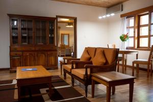 a living room with a couch and a table at Esther's Hotel in Accra