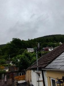 a view of a town with houses and trees at Cwtch Cottage in Rhondda