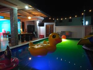 a yellow rubber duck in a swimming pool at เดอะเบสท์ พูลวิลล่า ขนอม in Ban Tha Chan