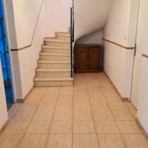an empty hallway with stairs and a stair case at Maison de 3 chambres avec jardin clos et wifi a Morbier in Morbier