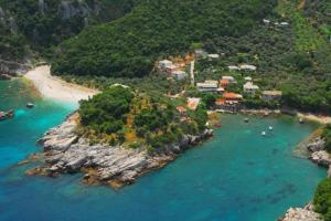 an aerial view of a small island in the water at The Yacht House in Agios Ioannis Pelio