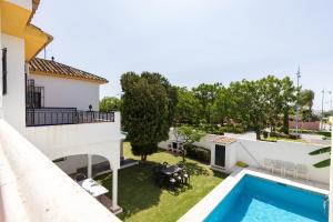 a view of the backyard of a house with a swimming pool at Casa Yolanda in Marbella