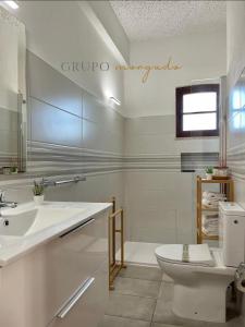 a white bathroom with a sink and a toilet at Grupo Morgado - Quinta do Morgado - Morgado House in Tavira