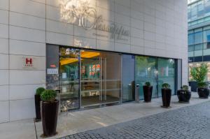 a store front with potted plants in front of it at Olissippo Oriente in Lisbon