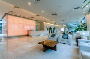 a lobby with couches and a table in a building at Olissippo Oriente in Lisbon