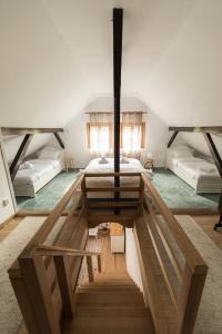 a room with a bed and two beds in it at Casa Mariei - Vila Breaza in Nistoreşti +110 photos