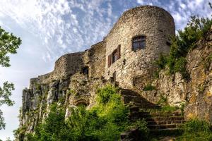 a building on the side of a mountain with stairs at Apartma Lavanda Istriana in Pobegi