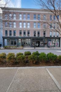 a building on a street with a building at Historic Guthrie Coke Lofts, Downtown Louisville in Louisville +8 photos