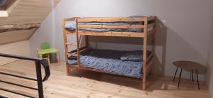 a couple of bunk beds in a room at Charmant Gite 6 Places Secteur Jura in Marigny