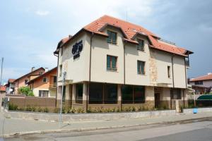 a building on the side of a street at Hotel BLISS Sofia Airport Self Check In in Kazichene