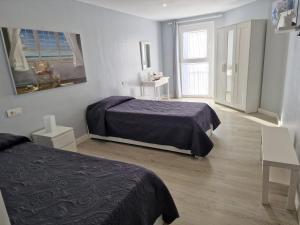 Ein Bett oder Betten in einem Zimmer der Unterkunft Crepúsculo