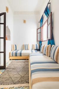 Кровать или кровати в номере Casa al Captane au Medina Tanger