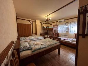 a room with four beds in a room at Machanents Guest House in Vagharshapat