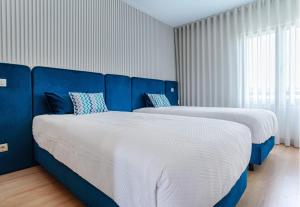 Postel nebo postele na pokoji v ubytování Marina Lagos Apartments II, junto à água da premiada Marina de Lagos + 35 fotografií