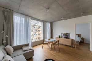 a living room with a couch and a table at Carlotta Apartments in Berlin