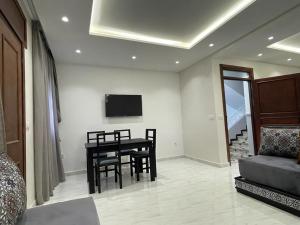 TV a/nebo společenská místnost v ubytování Residence Al-Bahr
