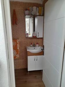 a bathroom with a sink and a mirror at Chez ouaki in Salé