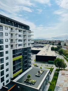 an aerial view of a building and a parking lot at The Palm 2 Apartment - family friendly, central, self check-in in Oradea