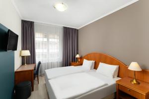 Danubius Hotel Raba客房内的一张或多张床位