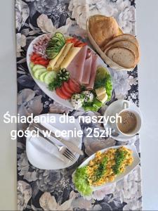 a picture of two plates of food and bread at Domy z Bala - Bungalow 50 metrów od Plaży spa domki ogrzewane in Dziwnówek
